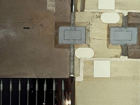 Part of a parking garage wall that looks like a modern abstract painting